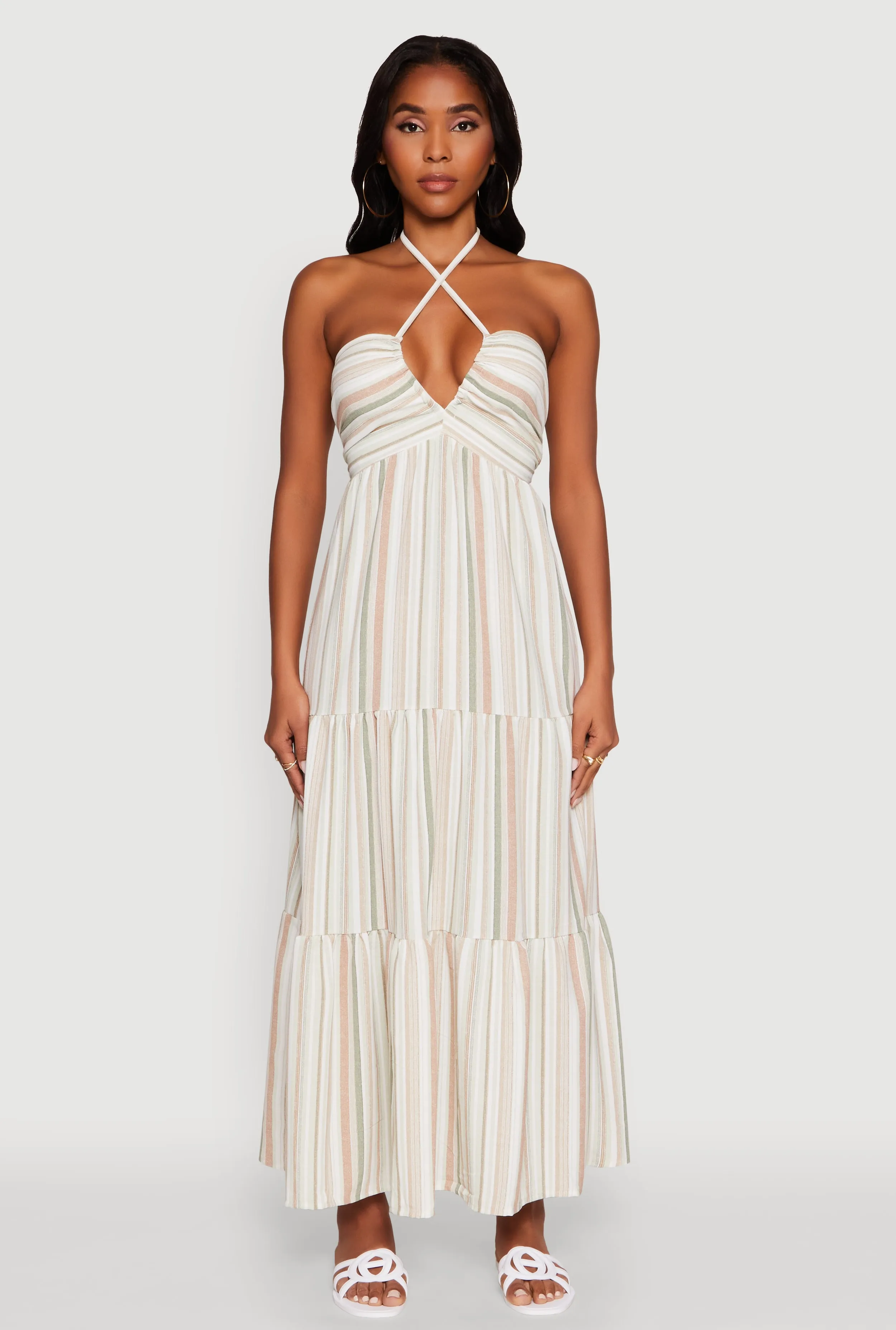 The flowing nature of this dress provides a relaxed fit while still looking elegant Madden Girl Striped Tiered Halter Maxi Dress