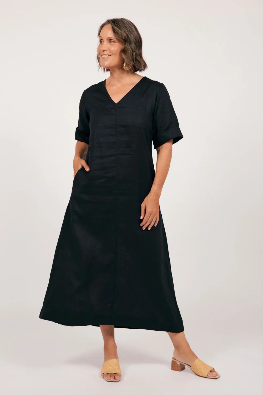 Tamara Linen V-Neck Dress in Black Glass Glow Perfect for casual outings or formal events this dress can be styled to suit any occasion