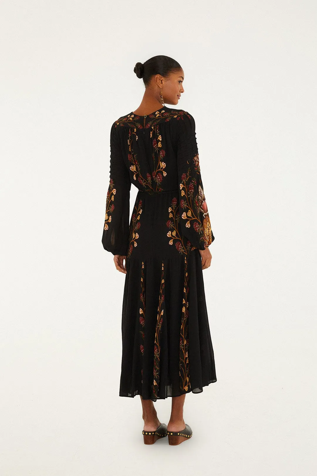 With its sleek and chic design this dress is perfect for both casual and formal settings Black Berry Garden Long Sleeve Pleated Maxi Dress