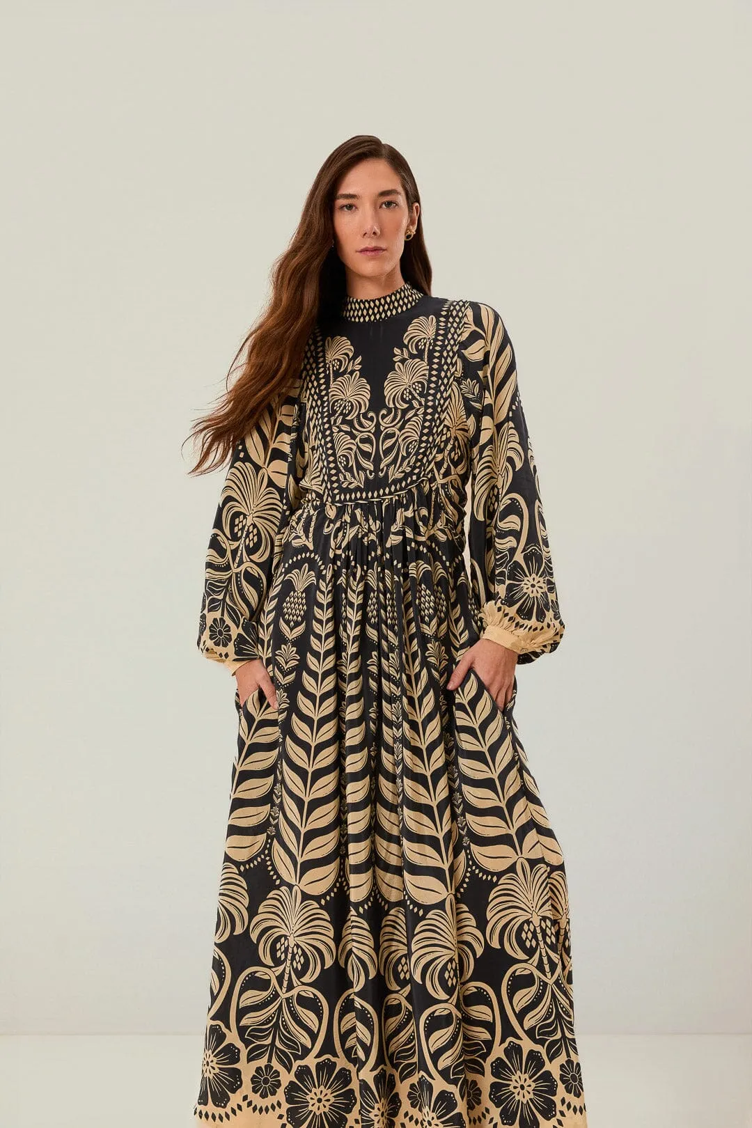 With its simple silhouette this maxi dress offers a flattering look for all body types Navy Blue Ainika Tropical Splendor Maxi Dress