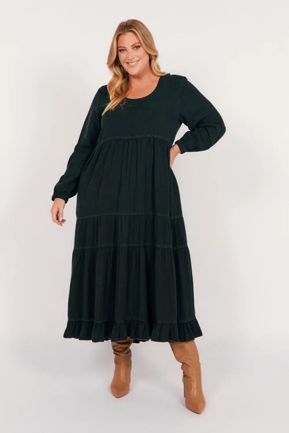 Sabre Tencel Maxi Dress in Black Dune Glow With its sleek and chic design this dress is perfect for both casual and formal settings